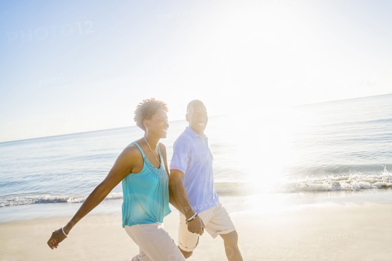 Mature couple walking on beach