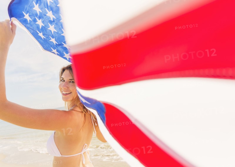 Woman holding American flag