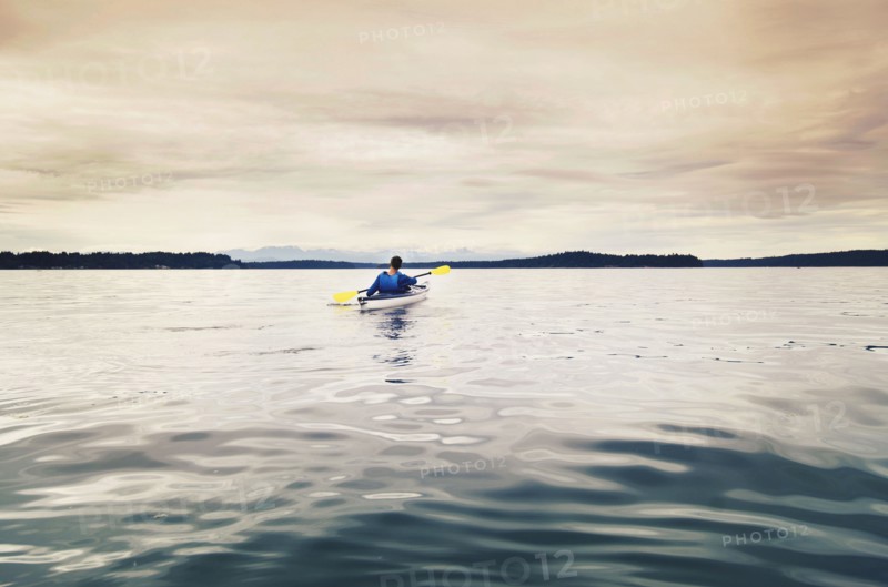 Man kayaking on lake