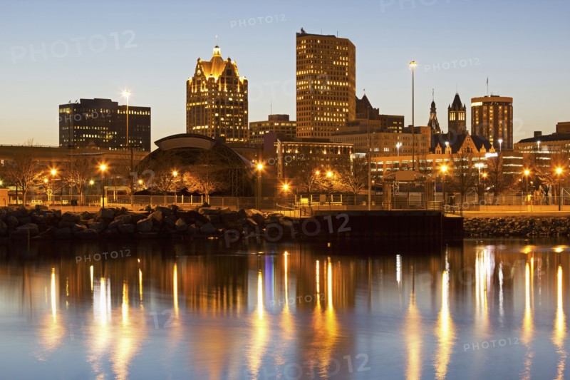 Street lights reflecting in lake