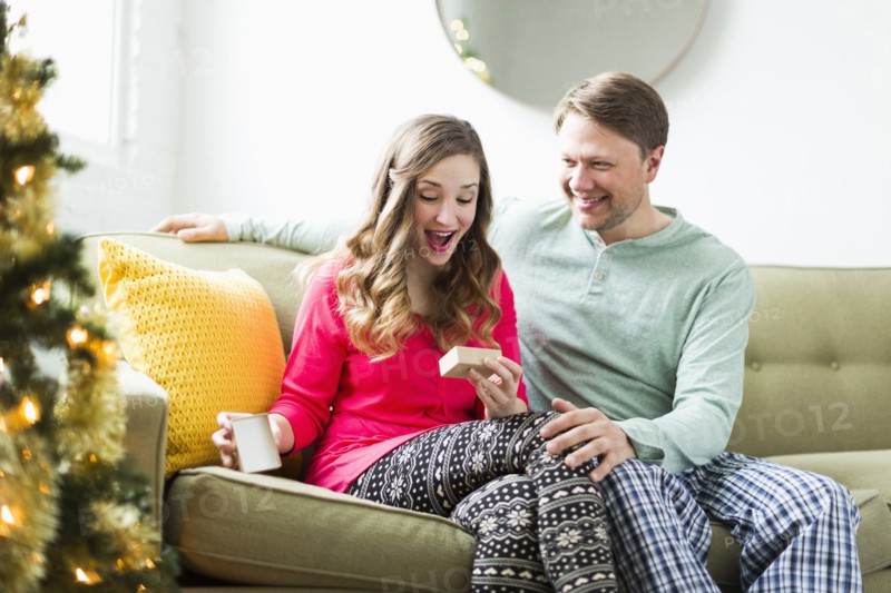 Young woman surprised with Christmas gift