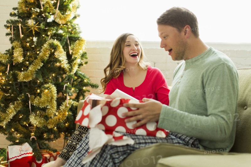 Young man surprised with Christmas gift