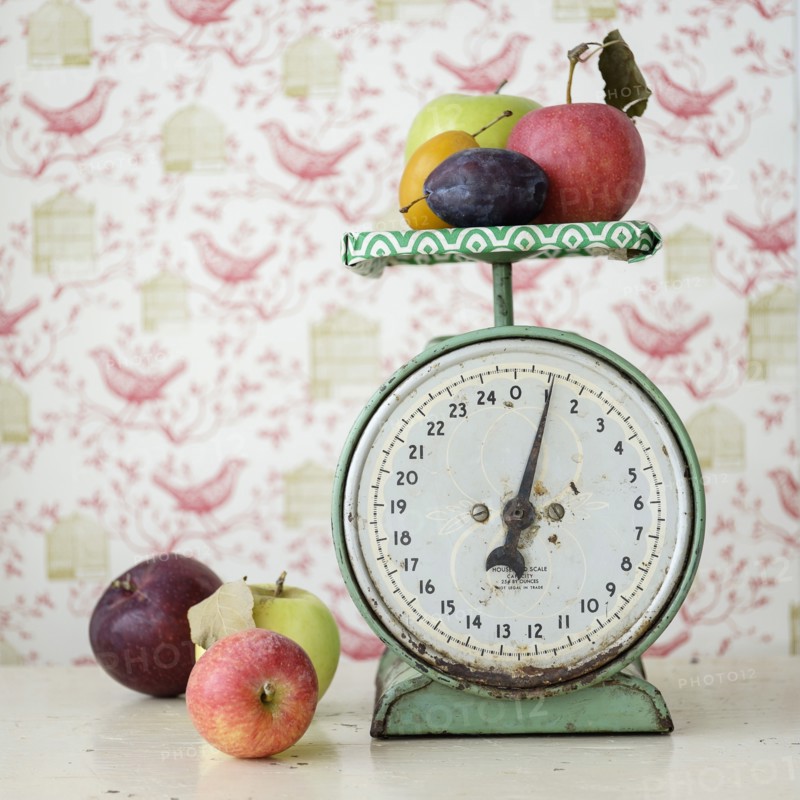 Studio shot of fruits on weight scale.