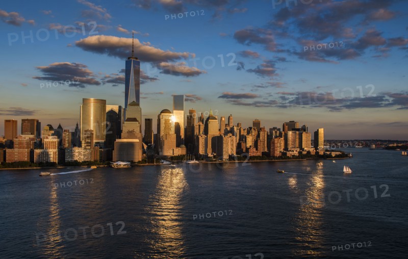 Aerial view of city with Freedom tower at sunset. New York City, New York.