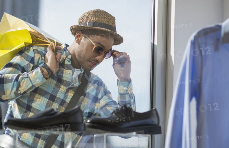Stylish man window shopping.