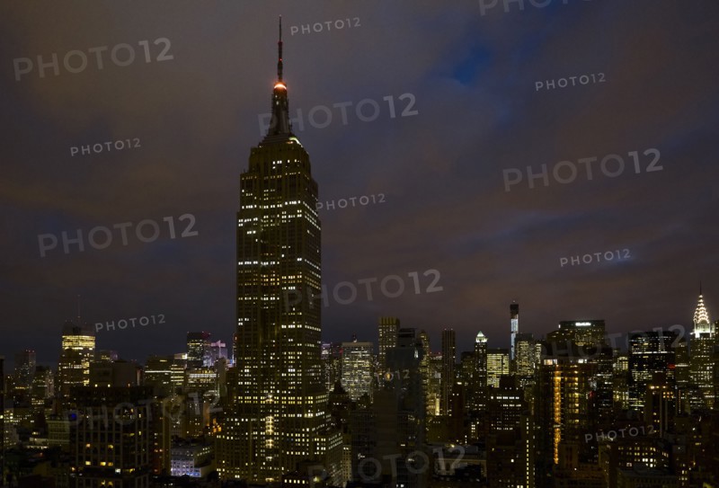 Cityscape with Empire State Building at night. New York City, New York.