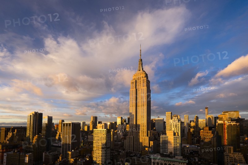 Cityscape with Empire State Building at sunset. New York City, New York.