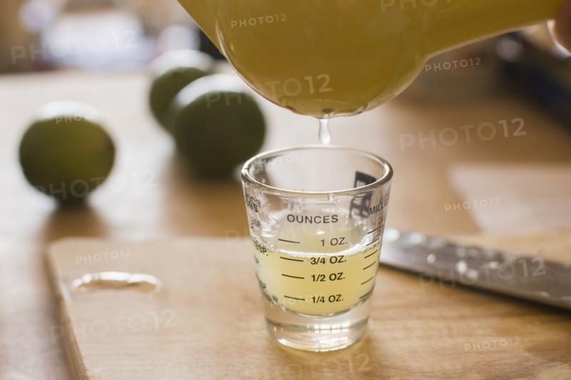 Close-up of liquid being poured into shot glass