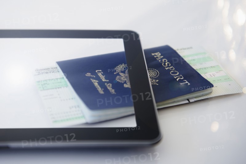 Digital tablet, airplane tickets and passport