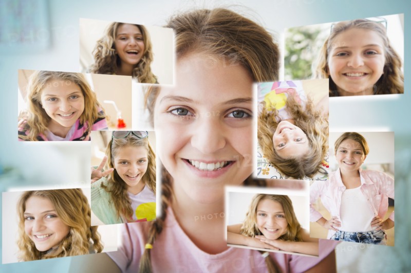 Girl (12-13) surrounded by photos of herself