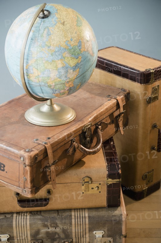 Studio shot of globe on suitcases