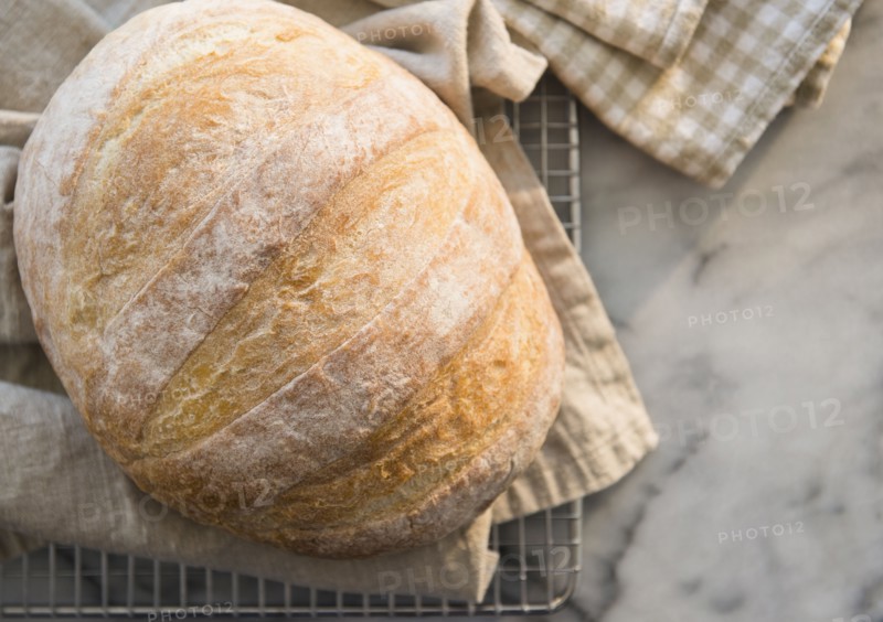 Studio shot of bread on dishcloth