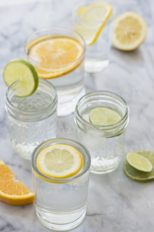 Studio shot of lemon, orange and lime drinks