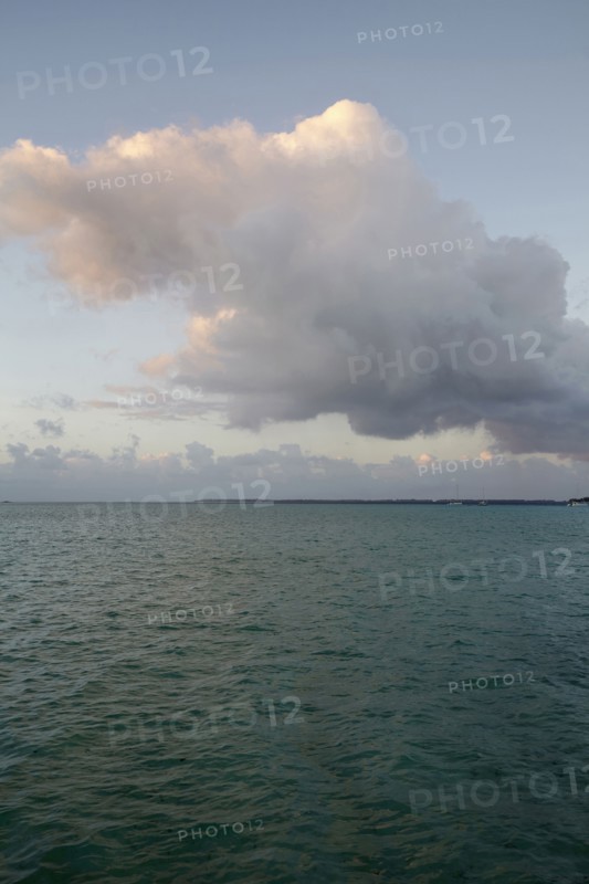 Cloudy sky above calm sea