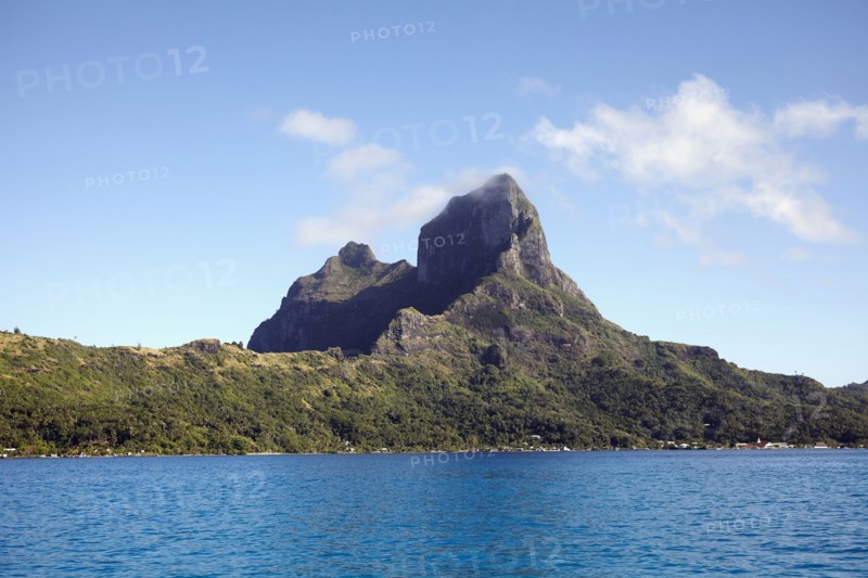Landscape with rocky mountains and calm sea
