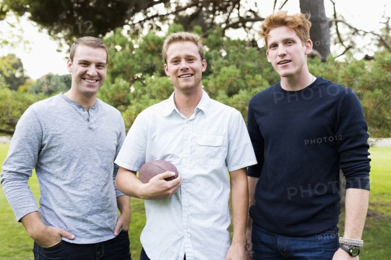 Portrait of young men with football