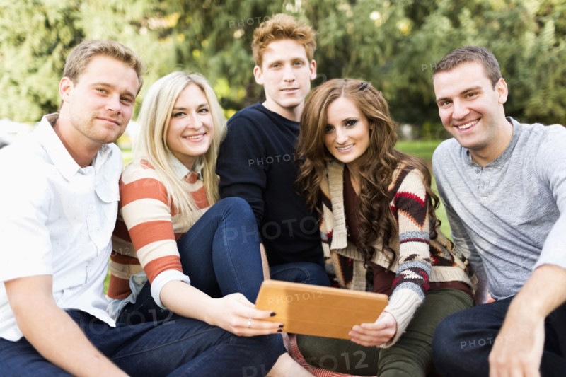 Portrait of friends with digital tablet