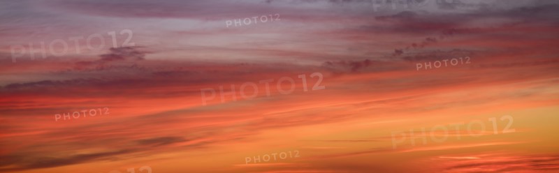 Panoramic view of sunrise sky with clouds.