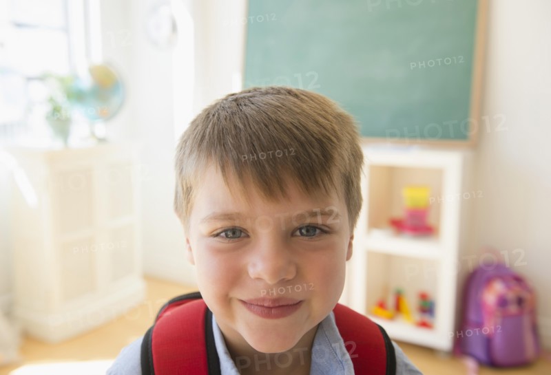 Portrait of boy (6-7) in classroom