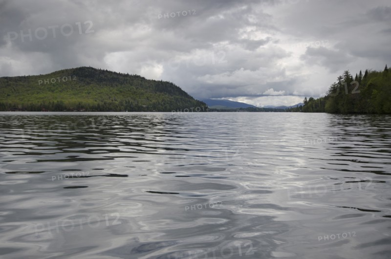 Scenic view of lake on cloudy day