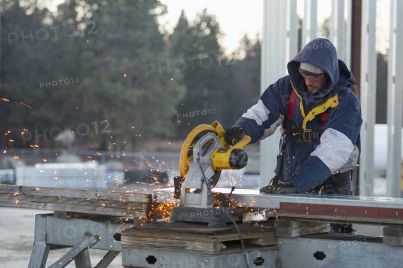 Man cutting steel bar