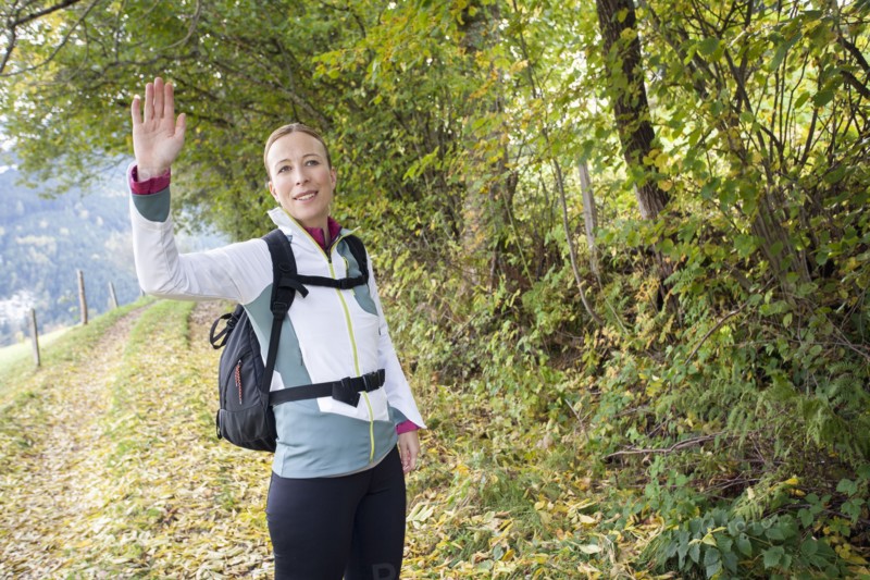 Woman waving at camera
