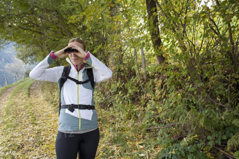 Woman looking through binoculars