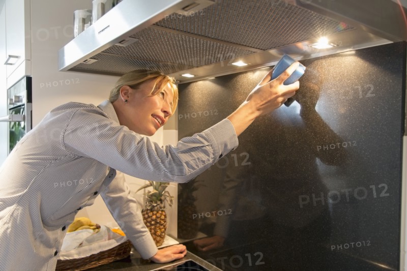 Woman cleaning kitchen