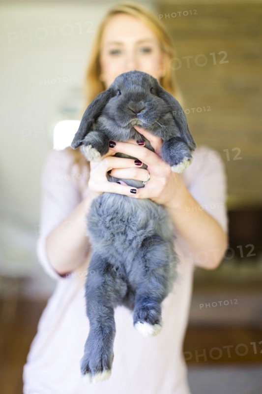Portrait of young woman and her bunny