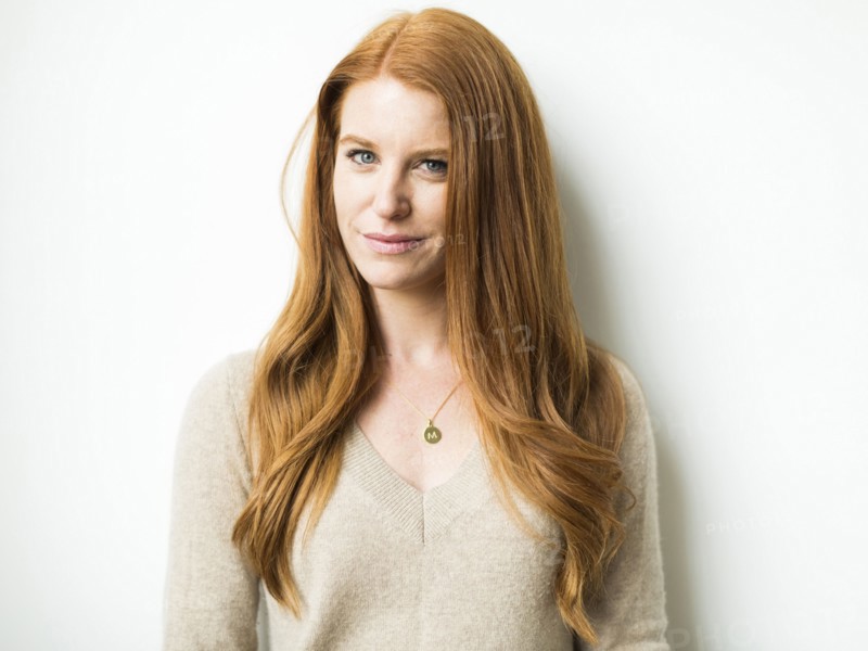 Portrait of woman with long red hair
