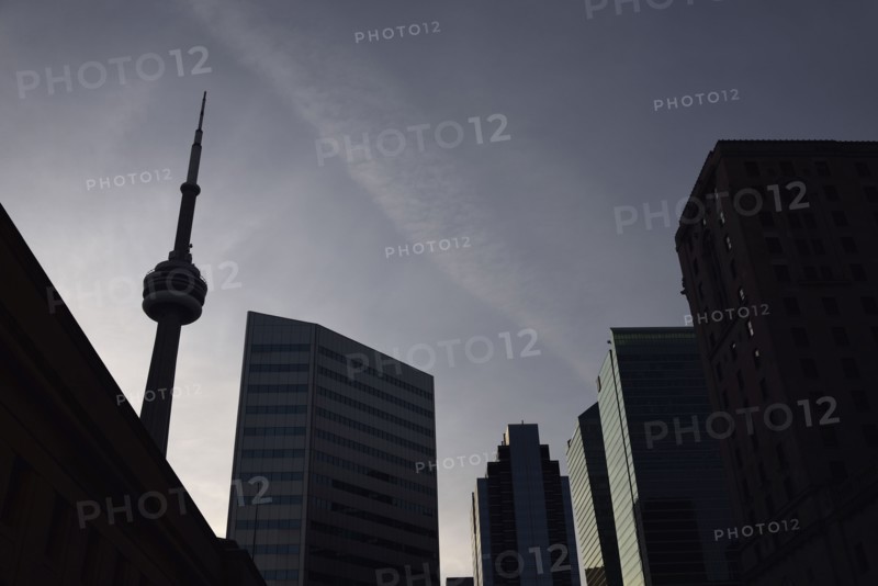 Low angle view of city architecture and communications tower
