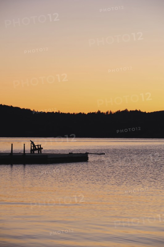 Jetty on lake at dawn
