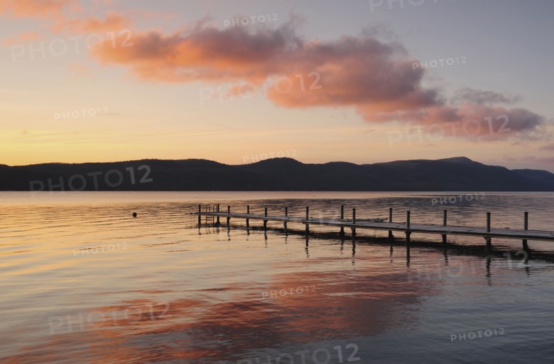 Jetty on lake at dawn