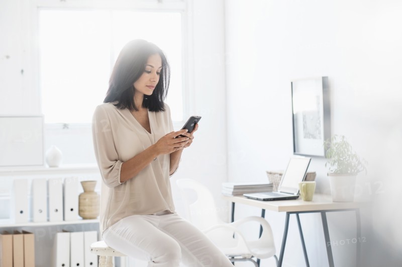 Woman using smart phone.
