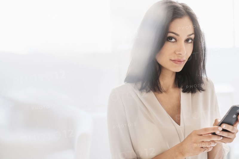 Woman using smart phone.