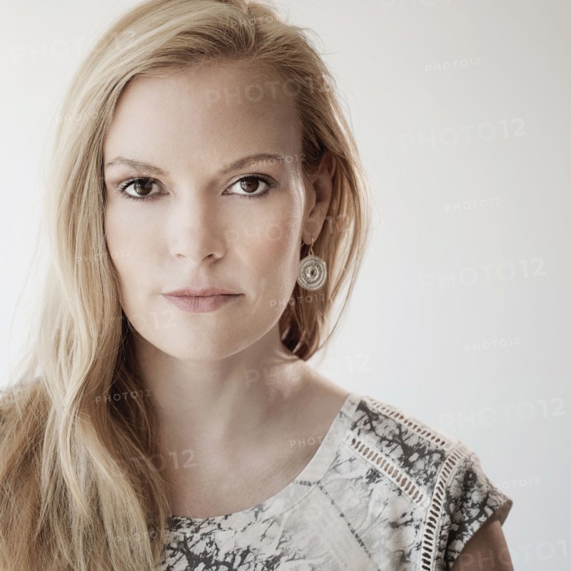 Portrait of mid-adult woman on white background.