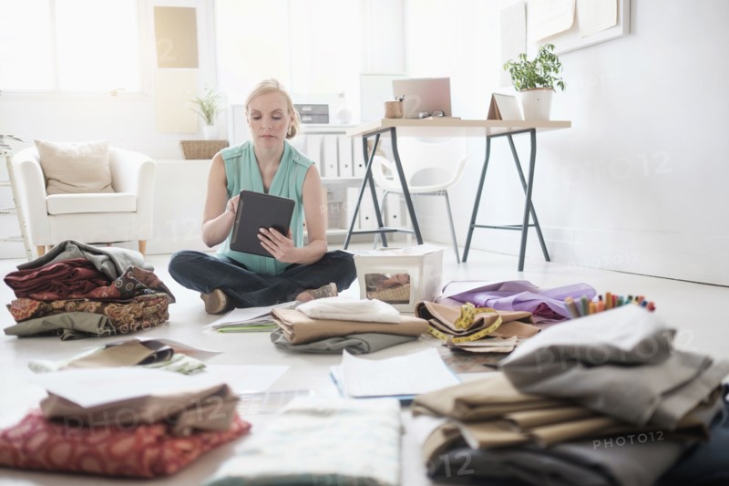 Design professional working in living room.
