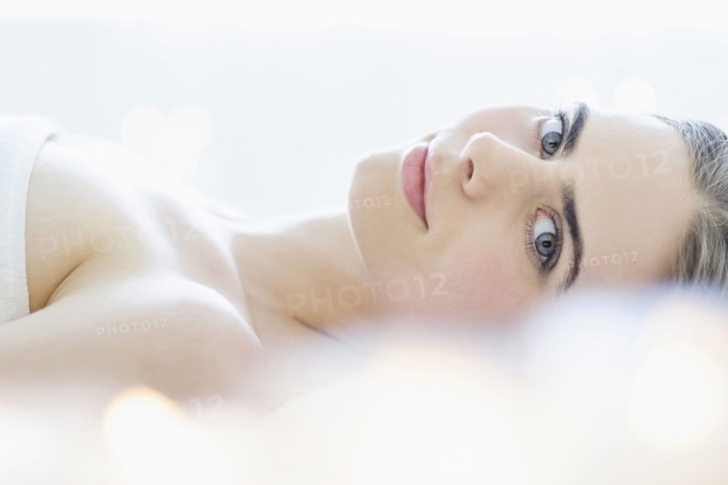 Portrait of young woman during beauty treatment.