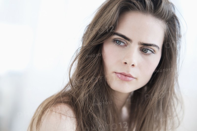 Portrait of young woman with blue eyes.