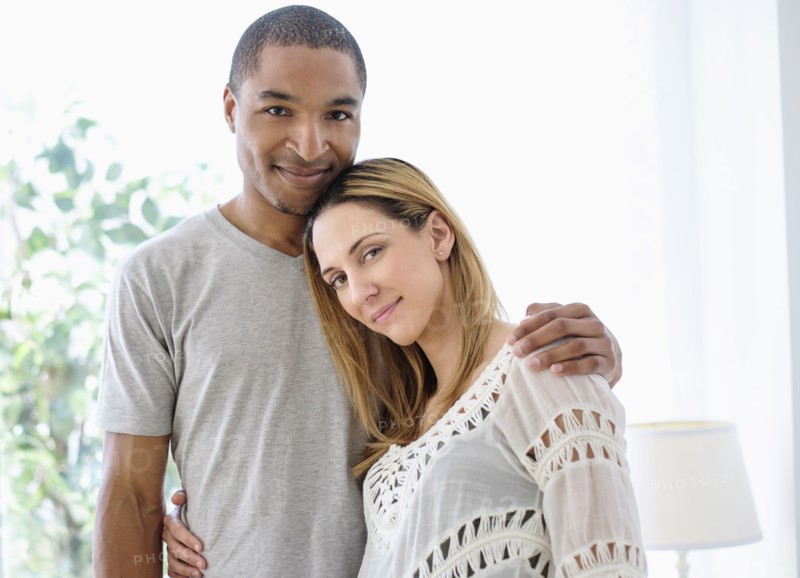 Mid adult couple embracing.