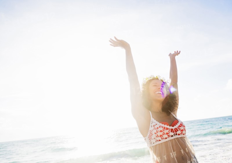 Young woman smiling on beach
