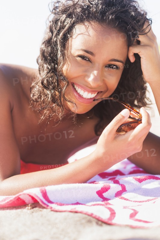 Young woman smiling on beach