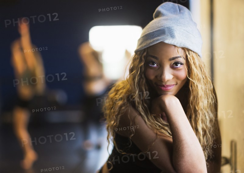 Portrait of female dancer with friends in background