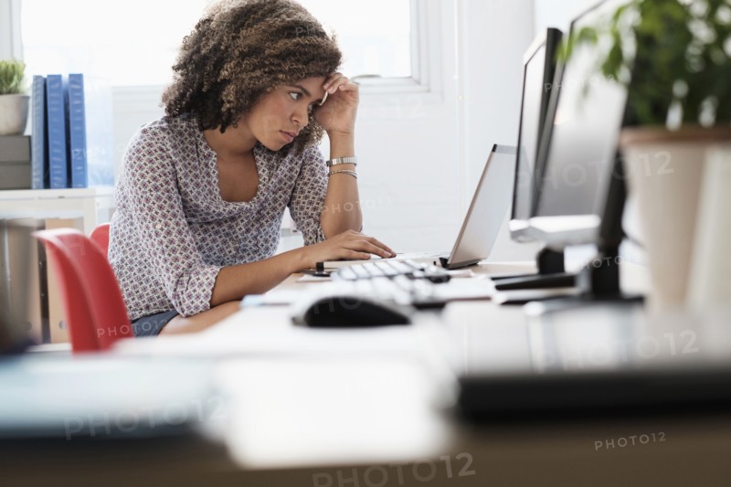 Young woman working at office.