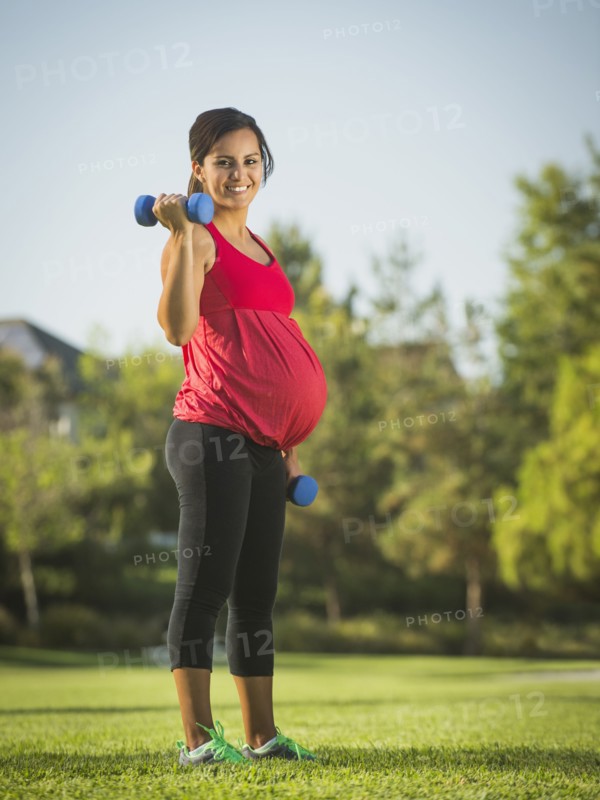 Pregnant woman exercising outdoors