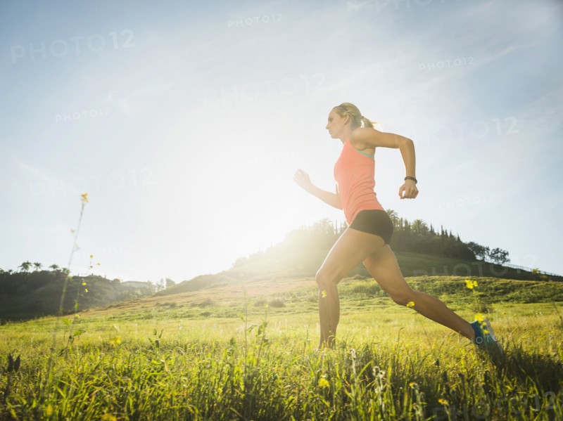 Woman running in field