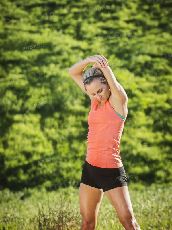 Woman exercising in field