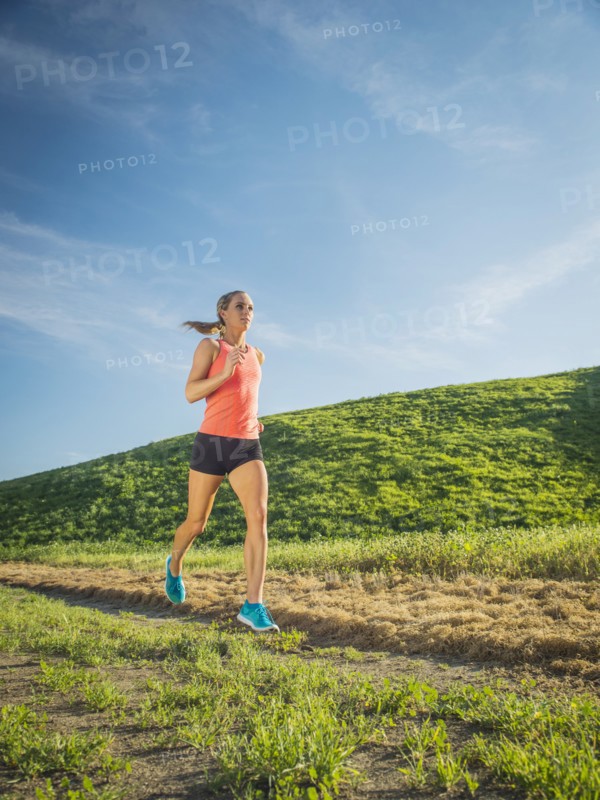 Woman running in field