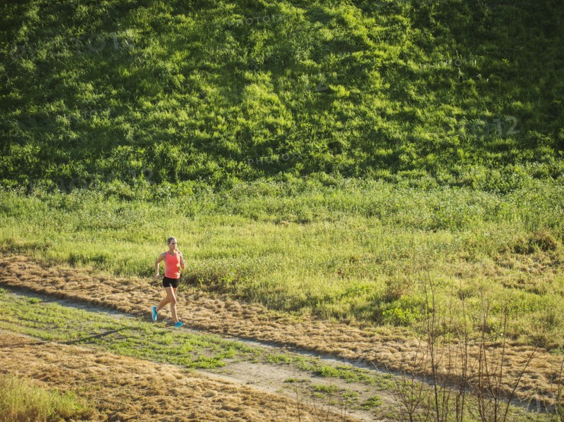 Woman running in field