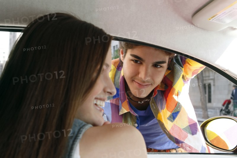 Couple flirting in car